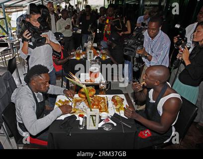 Bildnummer: 60084453  Datum: 09.07.2013  Copyright: imago/Xinhua (130709) -- NAIROBI, July 9, 2013 (Xinhua) -- Four contestants take part in a burger challenge at Brew Bistro in Nairobi, capital of Kenya, July 9, 2013. Four contestants had one hour to finish a 5kg burger with beef, two huge burger buns and 40 toppings. Sauti Sol team won the burger challenge. (Xinhua/Li Jing) KENYA-NAIROBI-BURGER CHALLENGE PUBLICATIONxNOTxINxCHN Gesellschaft Kultur Burgerwettessen Food Hamburger Burger Wettessen xdp x0x 2013 quer premiumd      60084453 Date 09 07 2013 Copyright Imago XINHUA  Nairobi July 9 201 Stock Photo