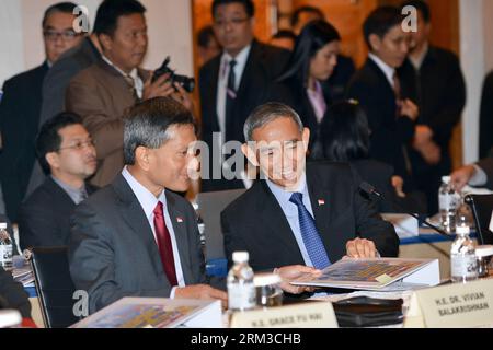 Bildnummer: 60139262  Datum: 17.07.2013  Copyright: imago/Xinhua (130717) -- KUALA LUMPUR, July 17, 2013 (Xinhua) -- Singapore s Minister for Environment and Water Resources Vivian Balakrishnan (L) attends the 15th Ministerial Steering Committee Meeting on Transboundary Haze Pollution in Kuala Lumpur, Malaysia, on July 17, 2013. Officials from the haze- inflicted Southeast Asian countries tried to make joint effort to end the heavy smog that troubles the region despite differences at a ministerial meeting here on Wednesday. (Xinhua/Chong Voon Chung) (bxq) MALAYSIA-KUALA LUMPUR-MINISTERIAL MEET Stock Photo