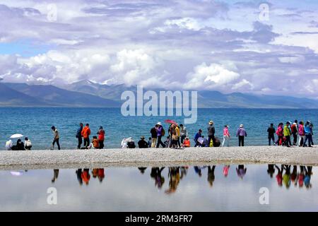 Bildnummer: 60171756  Datum: 19.07.2013  Copyright: imago/Xinhua LHASA, July 2013 - Tourists visit Lake Namtso in southwest China s Tibet Autonomous Region, July 19, 2013. Namtso, meaning the heavenly lake in Tibetan language, has become one of the preferences for a growing number of tourists to Tibet. (Xinhua/Wang Song) (zc) CHINA-TIBET-NAMTSO-TOURISM(CN) PUBLICATIONxNOTxINxCHN Gesellschaft x0x xsk 2013 quer     60171756 Date 19 07 2013 Copyright Imago XINHUA Lhasa July 2013 tourists Visit Lake Namtso in Southwest China S Tibet Autonomous Region July 19 2013 Namtso Meaning The Heavenly Lake i Stock Photo