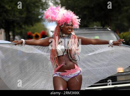 Bildnummer: 60223421  Datum: 27.07.2013  Copyright: imago/Xinhua A reveler parades during annual Multicultural Caribbean Days Parade in North Vancouver, BC, Canada on July 27, 2013. The Caribbean Days Parade, part of Caribbean Days Festival, one of the biggest events of its kind in Canada, celebrated Caribbean culture and style. (Xinhua/Sergei Bachlakov) CANADA-VANCOUVER-CARIBBEAN DAYS PARADE PUBLICATIONxNOTxINxCHN xns x0x 2013 quer     60223421 Date 27 07 2013 Copyright Imago XINHUA a Revel Parades during Annual MULTICULTURAL Caribbean Days Parade in North Vancouver BC Canada ON July 27 2013 Stockfoto
