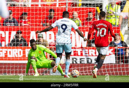 Manchester, UK. 26th Aug, 2023. Nottingham Forest's Taiwo Awoniyi (C) is on his way to scoring the opening goal during the FA Premier League match between Manchester United FC and Nottingham Forest FC at Old Trafford in Manchester, Britain, on Aug. 26, 2023. Man Utd won 3-2. Credit: Xinhua/Alamy Live News Stock Photo