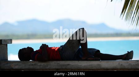 Bildnummer: 60765210  Datum: 28.11.2013  Copyright: imago/Xinhua     (131128) -- BEIJING , Nov. 28, 2013 (Xinhua) -- A man takes a rest at the beach in Sambava, Madagascar, Nov. 20, 2013. (Xinhua/Wu Xiaoling) (zhf) MADAGASCAR-SAMBAVA-LANDSCAPE PUBLICATIONxNOTxINxCHN xcb x0x 2013 quer Stock Photo