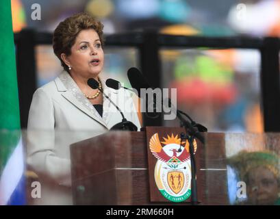 Bildnummer: 60815168  Datum: 10.12.2013  Copyright: imago/Xinhua     (131210) -- JOHANNESBURG, Dec. 10, 2013 -- Brazilian President Dilma Rousseff addresses the state memorial service for Nelson Mandela at the FNB Stadium in Johannesburg, south Africa, Dec. 10, 2013. Memorial service for former South African President Nelson Mandela started in Johannesburg on Tuesday as tens of thousands of mourners and more than 90 world leaders gather in rain to remember Mandela at memorial. (Xinhua/Meng Chenguang) SOUTH AFRICA-JOHANNESBURG-NELSON MANDELA-MEMORIAL SERVICE PUBLICATIONxNOTxINxCHN Politik Peopl Stock Photo