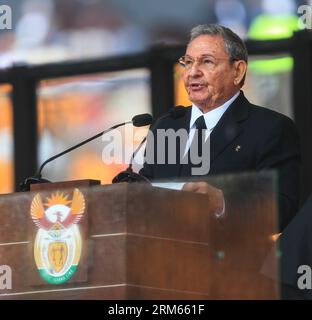 Bildnummer: 60815166  Datum: 10.12.2013  Copyright: imago/Xinhua     (131210) -- JOHANNESBURG, Dec. 10, 2013 -- Cuban leader Raul Castro addresses the state memorial service for Nelson Mandela at the FNB Stadium in Johannesburg, south Africa, Dec. 10, 2013. Memorial service for former South African President Nelson Mandela started in Johannesburg on Tuesday as tens of thousands of mourners and more than 90 world leaders gather in rain to remember Mandela at memorial. (Xinhua/Meng Chenguang) SOUTH AFRICA-JOHANNESBURG-NELSON MANDELA-MEMORIAL SERVICE PUBLICATIONxNOTxINxCHN Politik People Gedenkfe Stock Photo