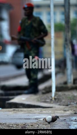 (131230) -- KINSHASA, Dec. 30, 2013 (Xinhua) -- The road to the Congolese national TV (TRNC) is blocked by the police in Kinshasa, DR Congo, Dec. 30, 2013. Clashes happening Monday morning in Kinshasa have almost come to an end. The government has had the situation under control. At least 40 attackers who took part in multiple gunfights in the city were killed, said a government source. (Xinhua/Wang Bo) DR CONGO-KINSHASA-CLASHES PUBLICATIONxNOTxINxCHN   Kinshasa DEC 30 2013 XINHUA The Road to The Congolese National TV  IS blocked by The Police in Kinshasa Dr Congo DEC 30 2013 clashes happening Stock Photo