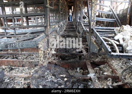 (140109) -- THANE, Jan. 8, 2014 (Xinhua) -- Photo taken on Jan. 8, 2014 shows the inside of the burnt coach of Mumbai-Dehradun Express which caught fire at Dahanu in Thane district of Maharashtra, India. Nine people, including one woman, were charred to death in a major fire which broke out on the express train in the western Indian state of Maharashtra in the early hours of Wednesday, a senior police officer said. (Xinhua/Stringer) INDIA-MAHARASHTRA-EXPRESS TRAIN-FIRE PUBLICATIONxNOTxINxCHN   Jan 8 2014 XINHUA Photo Taken ON Jan 8 2014 Shows The Inside of The Burnt Coach of Mumbai  Shipping W Stock Photo