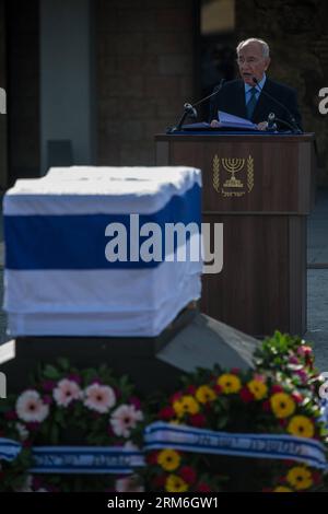 (140113) -- JERUSALEM, Jan. 13, 2014 (Xinhua) -- Israeli President Shimon Peres addresses a state memorial ceremony of former Israeli Prime Minister Ariel Sharon at Israel s Knesset (parliament) in Jerusalem, on Jan. 13, 2014. The state memorial service was held here on Monday attended by international leaders, including U.S. Vice President Joe Biden and Quartet representative and former British Prime Minister Tony Blair. Former Israeli Prime Minister Ariel Sharon, a controversial figure that altered the course of the Middle East, died at a hospital near Tel Aviv in central Israel at the age o Stock Photo