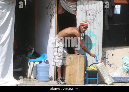 (140114) -- SAO PAULO, Jan. 14, 2014 (Xinhua) -- A man remains in the Luz neighborhood, also known by the residents as Crackland , in Sao Paulo, Brazil, on Jan. 14, 2014. In the recent years the country experiences a public health emergency according to the high growth of human outdoors establishments named like Crackland in the urban centers of the big cities like Sao Paulo and Rio de Janeiro, where hundreds of people gather to use drugs. The Sao Paulo City Hall announced last week a program that will begin to offer jobs and housing for the drug users in the region to undergo medical treatmen Stock Photo