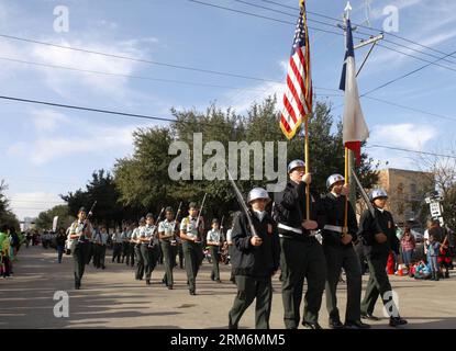 (140120) -- HOUSTON, Jan. 20, 2014 (Xinhua) -- Members of an honor guard march during a parade to mark the Martin Luther King Day in Houston, Jan. 20, 2014. Various activities are held on the third Monday of January each year throughout the United States to honor Martin Luther King Jr., who was assassinated on April 4, 1968 at the age of 39. (Xinhua/Song Qiong) US-HOUSTON-MLK DAY-COMMEMORATION PUBLICATIONxNOTxINxCHN   Houston Jan 20 2014 XINHUA Members of to HONOR Guard March during a Parade to Mark The Martin Luther King Day in Houston Jan 20 2014 Various Activities are Hero ON The Third Mond Stock Photo