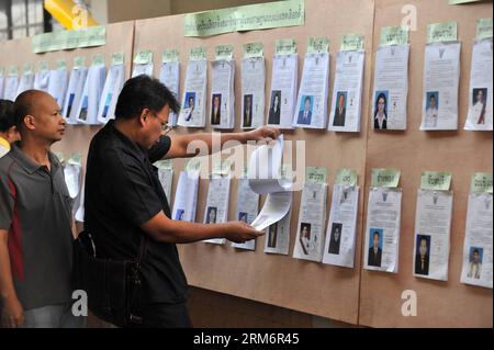 (140126) -- BANGKOK, Jan. 26, 2014 (Xinhua) -- A man reads the information of the candidates at a polling station in Bangkok, capital of Thailand, Jan. 26, 2014. Thailand s anti-government protestors on Sunday disrupted the advance voting for the Feb. 2 election in the capital Bangkok and several southern provinces. (Xinhua/Gao Jianjun)(hy) THAILAND-BANGKOK-ADVANCE VOTING PUBLICATIONxNOTxINxCHN   Bangkok Jan 26 2014 XINHUA a Man reads The Information of The Candidates AT a Polling Station in Bangkok Capital of Thai country Jan 26 2014 Thai country S Anti Government protestors ON Sunday disrupt Stock Photo