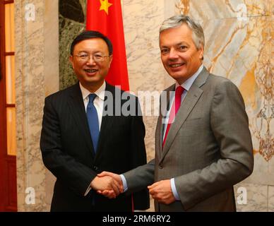 BRUSSELS, Jan. 27, 2014 - Chinese State Councilor Yang Jiechi (L) shakes hands with Belgian Vice Prime Minister and Minister of Foreign Affairs and Foreign Trade Didier Reynders during a meeting in Brussels, Belgium, Jan. 27, 2014. (Xinhua/Gong Bing)(axy) BELGIUM-BRUSSELS-YANG JIECHI-DIDIER REYNDERS-MEETING PUBLICATIONxNOTxINxCHN   Brussels Jan 27 2014 Chinese State Councilors Yang Jiechi l Shakes Hands With Belgian Vice Prime Ministers and Ministers of Foreign Affairs and Foreign Trade Didier Reynders during a Meeting in Brussels Belgium Jan 27 2014 XINHUA Gong Bing axy Belgium Brussels Yang Stock Photo