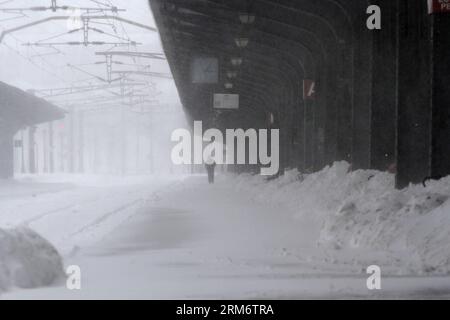 BUCHAREST, Jan. 29, 2014 (Xinhua) -- A man waits for a train at the main railway station in Bucharest, capital of Romania, Jan. 29, 2014. A new heavy snowstorm Wednesday began to hit Romania s capital as well as the south and the southeast. the Romanian authorities declared a state of emergency in four more counties of Ialomita, Calarasi, Constanta and Tulcea to better enable response to the current snowstorm. (Xinhua/Gabriel Petrescu)(axy) ROMANIA-BUCHAREST-SNOW EMERGENCY PUBLICATIONxNOTxINxCHN   Bucharest Jan 29 2014 XINHUA a Man Waits for a Train AT The Main Railway Station in Bucharest Cap Stock Photo