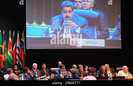 (140129) -- HAVANA, Jan. 29, 2014 (Xinhua) -- President of Venezuela Nicolas Maduro (C) is seen on a screen as he speaks during the second Summit of The Community of Latin American and Caribbean States (CELAC), in Havana, Cuba, on Jan. 29, 2014. The CELAC has declared the region a nuclear-free zone, Cuban leader Raul Castro announced Wednesday on the final day of the summit in Havana. (Xinhua/AVN) (ah) (sp) CUBA-HAVANA-POLITICS-CELAC PUBLICATIONxNOTxINxCHN   Havana Jan 29 2014 XINHUA President of Venezuela Nicolas Maduro C IS Lakes ON a Screen As he Speaks during The Second Summit of The Commu Stock Photo