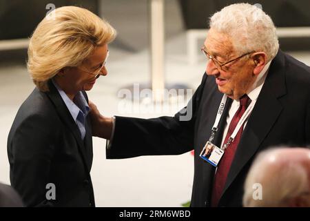 (140131) -- MUNICH, Jan. 31, 2014 (Xinhua) -- German Defense Minister Ursula von der Leyen (L) talks with former US Secretary of State Henry Kissinger during the Munich Security Conference in Munich, Germany, on Jan. 31, 2014. Von der Leyen called for further integration of European defense on Friday and said that Germany was prepared to take more responsibility. The 50th Munich Security Conference kicked off Friday afternoon in southern German city of Munich, and will run through Sunday. (Xinhua/Zhang Fan) GERMANY-MUNICH-SECURITY CONFERENCE-DEFENSE PUBLICATIONxNOTxINxCHN Stock Photo