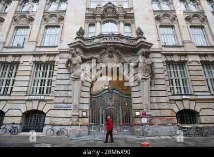 (140202) -- MUNICH,  (Xinhua) -- A pedestrian walks by a building blocked due to the Munich Security Conference near the event site of the Conference in Munich, Germany, on Feb. 2, 2014. (Xinhua/MSC/Mueller)(axy) GERMANY-MUNICH-SECURITY CONFERENCE PUBLICATIONxNOTxINxCHN   Munich XINHUA a Pedestrian Walks by a Building blocked Due to The Munich Security Conference Near The Event Site of The Conference in Munich Germany ON Feb 2 2014 XINHUA MSC Mueller axy Germany Munich Security Conference PUBLICATIONxNOTxINxCHN Stock Photo