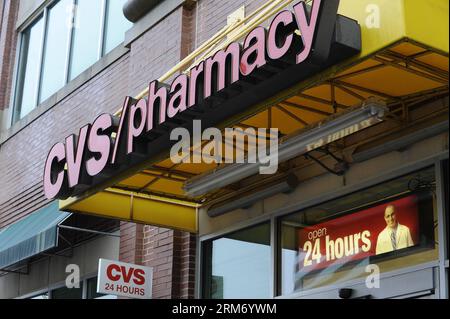 (140205) -- WASHINGTON D.C., Feb. 5, 2014 (Xinhua) -- Photo taken on Feb. 5, 2014 shows a view of the entrance of a CVS store in Arlington, Virginia. CVS Caremark, the second largest drugstore chain in the U.S., announced Wednesday it will stop selling cigarettes and other tobacco products in its more than 7,600 stores nationwide, a decision U.S. President Barack Obama immediately hailed as a powerful example and having a profoundly positive impact on the health of the country. (Xinhua/Zhang Jun) US-WASHINGTON-DRUGSTORE-CIGARETTES PUBLICATIONxNOTxINxCHN Stock Photo