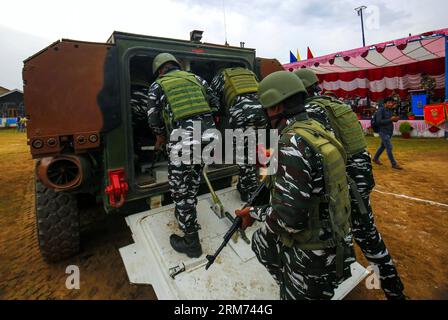 August 26, 2023, Srinagar Kashmir, India : Indian paramilitary Central Reserve Police Force (CRPF) soldiers enteres on a sophisticated vehicle during a demo of the two latest vehicles inducted by the CRPF at Lethpora in Pulwama, 20 km south of Srinagar. The CRPF inducted India-made Wheeled Armoured Amphibious Platform (WhAP) and Critical Situation Response Vehicles (CSRV) vehicles for operational purposes in Kashmir including law and order situations and countering militant activities. The sophisticated WhAP vehicle is capable of operating on land and also in marshy areas and streams using the Stock Photo