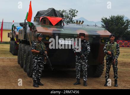 August 26, 2023, Srinagar Kashmir, India : Indian paramilitary Central Reserve Police Force (CRPF) soldiers stands guard near the sophisticated vehicles during a demo of the two latest vehicles inducted by the CRPF at Lethpora in Pulwama, 20 km south of Srinagar. The CRPF inducted India-made Wheeled Armoured Amphibious Platform (WhAP) and Critical Situation Response Vehicles (CSRV) vehicles for operational purposes in Kashmir including law and order situations and countering militant activities. The sophisticated WhAP vehicle is capable of operating on land and also in marshy areas and streams Stock Photo