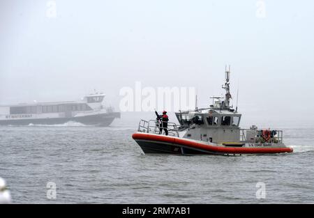 (140221) -- NEW YORK, Feb. 21, 2014 (Xinhua) -- A U.S. Coast Guard ship patrols near the shores of Manhattan, New York City, the United States, Feb. 21, 2014. A dense fog covered New York City through Friday afternoon, causing some departure delays at airports in and near the city. (Xinhua/Wang Lei) US-NEW YORK-WEATHER-FOG PUBLICATIONxNOTxINxCHN   New York Feb 21 2014 XINHUA a U S Coast Guard Ship Patrol Near The Shores of Manhattan New York City The United States Feb 21 2014 a dense Fog Covered New York City Through Friday Noon causing Some Departure DeLays AT Airports in and Near The City XI Stock Photo