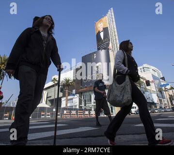 LOS ANGELES, Feb. 25, 2014 (Xinhua) -- People walk past the poster of the upcoming 86th Academy Awards in front of the Dolby Theater in Hollywood of Los Angeles, the United States, Feb. 25, 2014. The 86th Academy Awards will be held on March 2, 2014. (Xinhua/Zhao Hanrong) (zhf) US-LOS ANGELES-OSCAR-PREPARATIONS PUBLICATIONxNOTxINxCHN   Los Angeles Feb 25 2014 XINHUA Celebrities Walk Past The Poster of The upcoming 86th Academy Awards in Front of The Dolby Theatre in Hollywood of Los Angeles The United States Feb 25 2014 The 86th Academy Awards will Be Hero ON March 2 2014 XINHUA Zhao   U.S. Lo Stock Photo