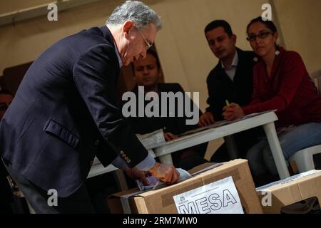 (140309) -- BOGOTA, March 9, 2014 (Xinhua) -- Former Colombian President Alvaro Uribe (L) casts his vote during the parliamentary elections in Bogota, capital of Colombia, on March 9, 2014. (Xinhua/Jhon Paz) (ce) COLOMBIA-BOGOTA-POLITICS-ELECTIONS PUBLICATIONxNOTxINxCHN   Bogota March 9 2014 XINHUA Former Colombian President Alvaro Uribe l casts His VOTE during The Parliamentary Elections in Bogota Capital of Colombia ON March 9 2014 XINHUA Jhon Paz CE Colombia Bogota POLITICS Elections PUBLICATIONxNOTxINxCHN Stock Photo