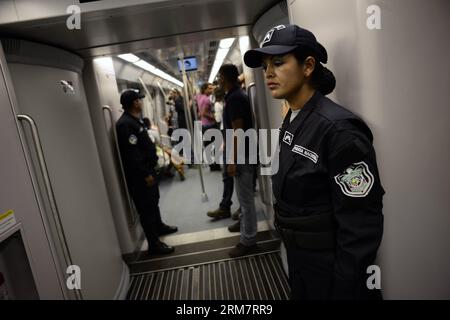 PANAMA CITY, March 13, 2014 - Members of the National Police guard a car of the Panama Metro during a test travel, in Panama City, capital of Panama, March 13, 2014. The Line 1 of the Panama Metro will be officially opened on April 5, with 13 stations and a lenght of 13.7km. (Xinhua/Mauricio Valenzuela) PANAMA-PANAMA CITY-INDUSTRY-TRANSPORTATION PUBLICATIONxNOTxINxCHN   Panama City March 13 2014 Members of The National Police Guard a Car of The Panama Metro during a trial Travel in Panama City Capital of Panama March 13 2014 The Line 1 of The Panama Metro will Be officially opened ON April 5 W Stock Photo