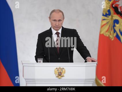 (140318) -- MOSCOW, March 18, 2014 (Xinhua) -- Russia s President Vladimir Putin addresses a joint session of Russian parliament on Crimea in the Kremlin in Moscow, Russia, March 18, 2014. Russian President Vladimir Putin signed an agreement on Tuesday accepting the Republic of Crimea and the city of Sevastopol as part of its territory, live TV broadcast showed. (Xinhua/RIA Novosti) (djj) RUSSIA-MOSCOW-CRIMEA-SEVASTOPOL-ADOPTION PUBLICATIONxNOTxINxCHN   Moscow March 18 2014 XINHUA Russia S President Vladimir Putin addresses a Joint Session of Russian Parliament ON Crimea in The KREMLIN in Mosc Stock Photo