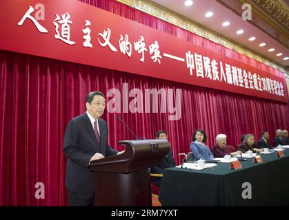 (140321) -- PEKING, 21. März 2014 (Xinhua) -- Yu Zhengsheng (L), Vorsitzender des Nationalen Komitees der Politischen Konsultativkonferenz des chinesischen Volkes, spricht an die Gedenkfeier anlässlich des 30. Jahrestages der Gründung der Chinesischen Stiftung für Behinderte in Peking, der Hauptstadt Chinas, am 21. März 2014. (Xinhua/Xie Huanchi)(wjq) CHINA-BEIJING-YU ZHENGSHENG-ACTIVITY (CN) PUBLICATIONxNOTxINxCHN Peking 21. März 2014 XINHUA Yu Zheng Sheng l Vorsitzender des Nationalen Komitees der chinesischen Prominenten S Political Consultative Conference spricht an die Gedenkfeier anlässlich des Jahres 30 Stockfoto