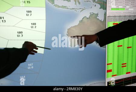 (140325) -- LONDON, March 25, 2014 (Xinhua) -- Vice president of Inmarsat Chris McLaughlin (R) and engineer Sue Selvaratnam work at a console cabinet in London, Britain, on March 25, 2014. Malaysia s acting Transport Minister Hishammuddin Hussein said Tuesday that UK Air Accidents Investigation Branch (AAIB) provides further details as how the data is analysed. He said Inmarsat, a British satellite telecommunications company, developed a second innovative technique in recent days which considers the velocity of the aircraft relative to the satellite. (Xinhua/Wang Lili) FOCUS UK-LONDON-INMARSAT Stock Photo