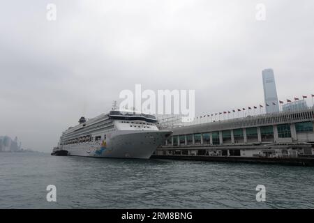 (140407) -- HONG KONG, April 7, 2014 (Xinhua) -- Photo taken on April 7, 2014 shows the cruise ship SuperStar Virgo at the Victoria Harbour of Hong Kong, south China. Owned by the Singaporean company Star Cruises, the SuperStar Virgo set sail from a port in Hong Kong on Monday, marking the opening of its itinerary from Hong Kong to Kaohsiung of southeast China s Taiwan. (Xinhua/Qin Qing) (zgp) CHINA-HONG KONG-CRUISE-SAILING CEREMONY (CN) PUBLICATIONxNOTxINxCHN   Hong Kong April 7 2014 XINHUA Photo Taken ON April 7 2014 Shows The Cruise Ship Superstar Virgo AT The Victoria Harbour of Hong Kong Stock Photo