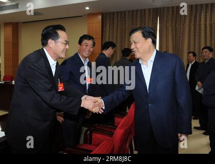 (140416) -- BEIJING, April 16, 2014 (Xinhua) -- Liu Yunshan (R, front), a member of the Standing Committee of the Political Bureau of the Central Committee of the Communist Party of China (CPC), shakes hands with a representative during a seminar attended by ministerial-level officials, in Beijing, China, April 16, 2014. The seminar was the seventh of its kind held by the Party School of the CPC Central Committee to study Xi s speeches and remarks. A total of 2,300 ministerial-level officials attended the seminars. (Xinhua/Rao Aimin) (zc) CHINA-BEIJING-LIU YUNSHAN-SEMINAR (CN) PUBLICATIONxNOTx Stock Photo