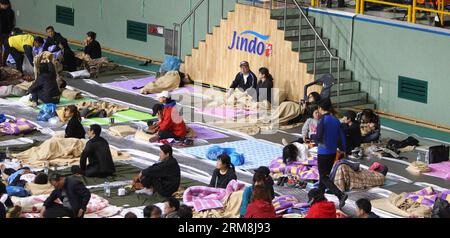 (140416) -- JINDO, April 16, 2014 (Xinhua) -- South Korean relatives of missing people wait at a gym in Jindo on April 16, 2014. A passenger ship with 462 people aboard, mostly high school students, sank in waters off South Korea s southwest coast Wednesday morning, leaving at least four people dead and 284 others missing, local media reported citing the central disaster and safety countermeasures headquarters.(Xinhua/Yao Qilin)(ctt) S.KOREA-JINDO-SHIP SINKS PUBLICATIONxNOTxINxCHN   April 16 2014 XINHUA South Korean Relatives of Missing Celebrities Wait AT a Gym in  ON April 16 2014 a Passenge Stock Photo