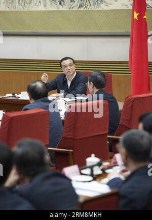 (140420) -- BEIJING, April 20, 2014 (Xinhua) -- Chinese Premier Li Keqiang (back C) presides over a meeting of the State Energy Commission in Beijing, capital of China, April 18, 2014. (Xinhua/Huang Jingwen) (wf) CHINA-BEIJING-LI KEQIANG-CONFERENCE (CN) PUBLICATIONxNOTxINxCHN   Beijing April 20 2014 XINHUA Chinese Premier left Keqiang Back C Presid Over a Meeting of The State Energy Commission in Beijing Capital of China April 18 2014 XINHUA Huang Jingwen WF China Beijing left Keqiang Conference CN PUBLICATIONxNOTxINxCHN Stock Photo