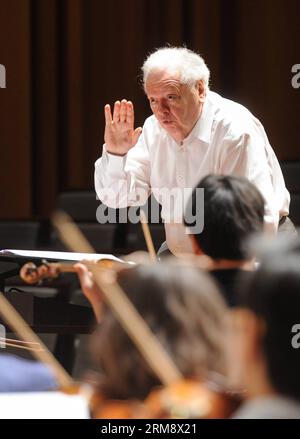 (140428) -- BEIJING, April 28, 2014 (Xinhua) -- Philippe Entremont, french conductor, rehearses at the National Center for the Performing Arts in Beijing, capital of China, April 28, 2014. Celebrating the 50th Anniversary of France-China Diplomatic Relations Concert , the opening performance of the 14th Meet in Beijing Arts Festival, kicked off on Monday. Philippe Entremont, french conductor, attends the concert together with symphony orchestras and choruses from China National Opera House. A total of 280 shows will be performed by 212 art groups from 33 countries and regions during the art fe Stock Photo