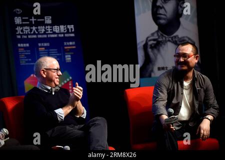 (140428) -- BEIJING , April 28, 2014 (Xinhua) --James Schamus(L), president of the jury of the 64th Berlin International Film Festival,and Wuershan, Chinese director, attend the activity Face to Face with Film Masters at Beijing Normal University in Beijing, April 28, 2014. The activity is a part of the 21st Beijing College Student Film Festival, which kicked off on April 8, 2014. (Xinhua/Jin Liangkuai) (zwy) CHINA-BEIJING-FACE TO FACE-FILM FESTIVAL(CN) PUBLICATIONxNOTxINxCHN   Beijing April 28 2014 XINHUA James Schamus l President of The Jury of The 64th Berlin International Film Festival and Stock Photo