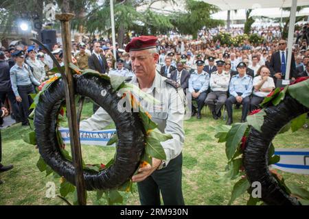 Israel Defense Forces (IDF) Chief of Staff Benny Gantz lays a wreath during a ceremony marking the Memorial Day honoring fallen soldiers at the Mount Herzel military cemetery in Jerusalem, on May 5, 2014. Israel marked the Remembrance Day from sunset of May 4 to sunset of May 5 to commemorate its 23,169 fallen servicemen and women and victims of terrorism. (Xinhua/JINI/Emil Salman)(bxq) MIDEAST-JERUSALEM-ISRAEL-REMEMBRANCE DAY PUBLICATIONxNOTxINxCHN   Israel Defense Forces IDF Chief of Staff Benny Gantz Lays a  during a Ceremony marking The Memorial Day honoring Fall Soldiers AT The Mount Herz Stock Photo