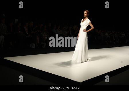 (140507) -- BARCELONA, May 7, 2014 (Xinhua) -- A model presents a creation by Spanish brand Victorio & Lucchino at the Barcelona Bridal Week in Barcelona, May 7, 2014. The Barcelona Bridal Week runs from May 6 to 11. (Xinhua/Pau Barrena) SPAIN-BARCELONA-BRIDAL WEEK PUBLICATIONxNOTxINxCHN   Barcelona May 7 2014 XINHUA a Model Presents a Creation by Spanish Brand Victorio & Lucchino AT The Barcelona Bridal Week in Barcelona May 7 2014 The Barcelona Bridal Week runs from May 6 to 11 XINHUA Pau  Spain Barcelona Bridal Week PUBLICATIONxNOTxINxCHN Stock Photo