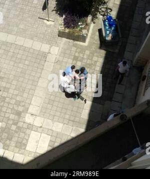 (140512) -- KUNMING, May 12, 2014 (Xinhua) -- Several people on site take down the suspect of an attack at Dianchi College of Yunnan University in Kunming, capital of southwest China s Yunnan Province, May 12, 2014. A man with a knife climbed into the girls dormitory at the college and hurt two girls Monday. The police have captured the suspect and the injured students have been sent to the hospital. (Xinhua)(wjq) CHINA-YUNNAN-KUNMING-ATTACK (CN) PUBLICATIONxNOTxINxCHN   Kunming May 12 2014 XINHUA several Celebrities ON Site Take Down The Suspect of to Attack AT Dianchi College of Yunnan Unive Stock Photo