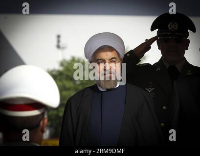 (140520) -- TEHRAN, May 20, 2014 (Xinhua) -- Iranian President Hassan Rouhani (C) inspects the honour guards before leaving for China at Mehrabad Airport in Tehran, Iran, on May 20, 2014. Rouhani left Tehran for Shanghai on Tuesday morning to attend the Conference on Interaction and Confidence Building Measures in Asia (CICA) summit, to be held in Shanghai on May 20-21. (Xinhua/Ahmad Halabisaz) (zjy) IRAN-CHINA-ROUHANI-CICA SUMMIT PUBLICATIONxNOTxINxCHN   TEHRAN May 20 2014 XINHUA Iranian President Hassan Rouhani C inspect The Honour Guards Before leaving for China AT Mehrabad Airport in TEHRA Stock Photo