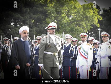 (140520)-- TEHRAN, May 20, 2014 (Xinhua) -- Iranian President Hassan Rouhani (L) inspects the honour guards before leaving for China at Mehrabad Airport in Tehran, Iran, on May 20, 2014. Rouhani left Tehran for Shanghai on Tuesday morning to attend the Conference on Interaction and Confidence Building Measures in Asia (CICA) summit, to be held in Shanghai on May 20-21. (Xinhua/Ahmad Halabisaz) (zjy) IRAN-CHINA-ROUHANI-CICA SUMMIT PUBLICATIONxNOTxINxCHN   TEHRAN May 20 2014 XINHUA Iranian President Hassan Rouhani l inspect The Honour Guards Before leaving for China AT Mehrabad Airport in TEHRAN Stock Photo