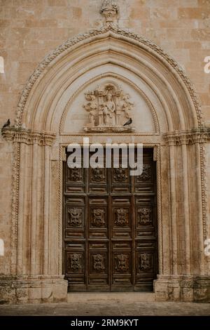 Door at church of San Francesco d’Assisi in Ostuni, Italy Stock Photo