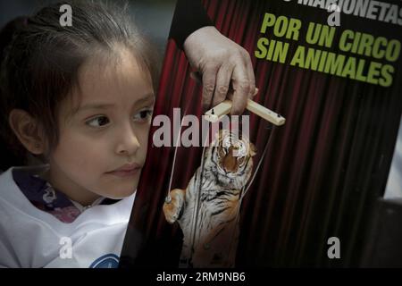 MEXICO CITY, May 27, 2014 -- A girl takes part in a protest organized by activists of AnimaNaturalis organization and people of different groups in front the U.S. Embassy, in Mexico City, capital of Mexico, on May 27, 2014. The protests took place on the sidelines of the Circuses Without Animals campaign, against the begining of the season of the Ringling Brothers and Barnum and Bailey Circus in Mexico, according to local press. (Xinhua/Alejandro Ayala) (da) (sp) (zjl) MEXICO-MEXICO CITY-SOCIETY-PROTEST PUBLICATIONxNOTxINxCHN   Mexico City May 27 2014 a Girl Takes Part in a Protest Organized b Stock Photo