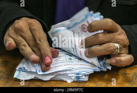 (140528) -- ALEXANDRIA, May 28, 2014 (Xinhua) -- An Egyptian electoral worker counts ballots at a polling station in Alexandria, costal city of Egypt, on May 28, 2014. Egypt s three-day voting has come to an end at 9 p.m. local time (1800GMT) on Wednesday for the first presidential election following the ouster of former Islamist President Mohamed Morsi. (Xinhua/Asmaa Abdelatif) EGYPT-PRESIDENTIAL ELECTION-CONCLUSION PUBLICATIONxNOTxINxCHN   Alexandria May 28 2014 XINHUA to Egyptian Electoral Worker Counts Ballots AT a Polling Station in Alexandria Costal City of Egypt ON May 28 2014 Egypt S T Stock Photo