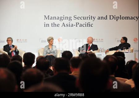 (140530) -- SINGAPORE, May 30, 2014 (Xinhua) -- Fu Ying (2nd L), chairwoman of the Foreign Affairs Committee of China s National People s Congress, attends the Shangri-La Dialogue in Singapore, May 30, 2014. Shangri-La Dialogue, which opened on Friday in Singapore, is a multilateral security dialogue forum that brings together senior military and political officials from nearly 30 countries to discuss regional security and cooperation. (Xinhua/Then Chih Wey) SINGAPORE-SHANGRI-LA DIALOGUE-CHINA-FU YING PUBLICATIONxNOTxINxCHN   Singapore May 30 2014 XINHUA Fu Ying 2nd l Chairwoman of The Foreign Stock Photo