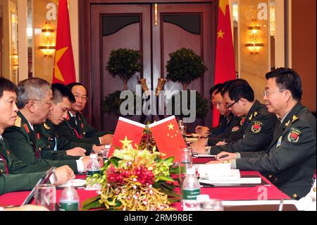 (140530) -- SINGAPORE, May 30, 2014 (Xinhua) -- Wang Guanzhong (1st R), deputy chief of general staff of the Chinese People s Liberation Army (PLA), meets with Vietnamese Deputy Minister of National Defense Nguyen Chi Vinh (2nd L) during the Shangri-La Dialogue in Singapore, May 30, 2014. China and Vietnam held a bilateral talk on the first day of the Shangri-La Dialogue in Singapore. (Xinhua/Then Chih Wey) SINGAPORE-SHANGRI-LA DIALOGUE-CHINA-VIETNAM PUBLICATIONxNOTxINxCHN   Singapore May 30 2014 XINHUA Wang Guanzhong 1st r Deputy Chief of General Staff of The Chinese Celebrities S Liberation Stock Photo