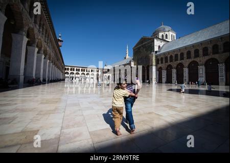 Syrian children play at Umayyad Mosque in Damascus, capital of Syria, on June 1, 2014, ahead of the presidential election on June 3. (Xinhua/Pan Chaoyue) SYRIA-DAMASCUS-PRESIDENTIAL ELECTION PUBLICATIONxNOTxINxCHN   Syrian Children Play AT Umayyad Mosque in Damascus Capital of Syria ON June 1 2014 Ahead of The Presidential ELECTION ON June 3 XINHUA Pan Chaoyue Syria Damascus Presidential ELECTION PUBLICATIONxNOTxINxCHN Stock Photo