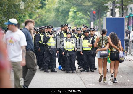 Police at the Children's Day Parade, part of the Notting Hill Carnival celebration in west London over the Summer Bank Holiday weekend. Picture date: Sunday August 27, 2023. Stock Photo