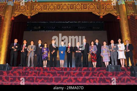 (140607) -- BEIJING, June 7, 2014 (Xinhua) -- The awarded association representatives and guests pose for a group photo during the 7th Conference for Friendship of Overseas Chinese Associations in Beijing, capital of China, June 7, 2014. (Xinhua/Chen Yehua) (yxb) CHINA-BEIJING-OVERSEAS CHINESE ASSOCIATIONS(CN) PUBLICATIONxNOTxINxCHN   Beijing June 7 2014 XINHUA The awarded Association Representatives and Guests Pose for a Group Photo during The 7th Conference for friendship of Overseas Chinese Associations in Beijing Capital of China June 7 2014 XINHUA Chen Yehua  China Beijing Overseas Chines Stock Photo