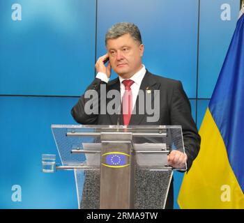 (140627) -- BRUSSELS, June 27, 2014 (Xinhua) -- Ukrainian President Petro Poroshenko attends a news conference after a agreement signing ceremony the European Union (EU) headquarters in Brussels, June 27, 2014. The European Union (EU) signed the Association Agreements with Ukraine, Georgia and Moldova on Friday with the aim of deepening political and economic ties with the three former Soviet republics. (Xinhua/Jiang Yan) (jl) EU-UKRAINE-ASSOCIATION AGREEMENT--NEWS CONFERENCE-POROSHENKO PUBLICATIONxNOTxINxCHN   Brussels June 27 2014 XINHUA Ukrainian President Petro Poroshenko Attends a News Co Stock Photo