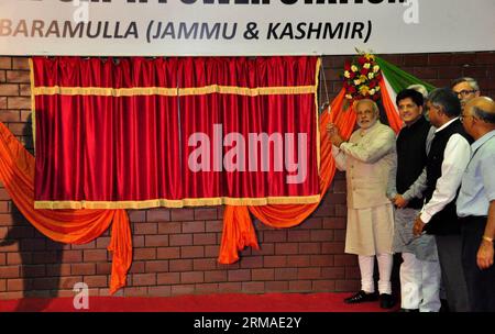 (140704) -- SRINAGAR, July 4, 2014 (Xinhua) -- A handout photo released by Indian-controlled Kashmir s local government shows Indian Prime Minister Narendra Modi (1st L) unveiling a Power Project in Uri, about 95 km north of Srinagar, the summer capital of Indian-controlled Kashmir, July 4, 2014. Modi Friday arrived in Indian-controlled Kashmir amid a complete shutdown across Muslim majority areas including the capital city Srinagar. (Xinhua) (zjl) KASHMIR-SRINAGAR-INDIA-PM-VISIT PUBLICATIONxNOTxINxCHN   Srinagar July 4 2014 XINHUA a handout Photo released by Indian Controlled Kashmir S Local Stock Photo